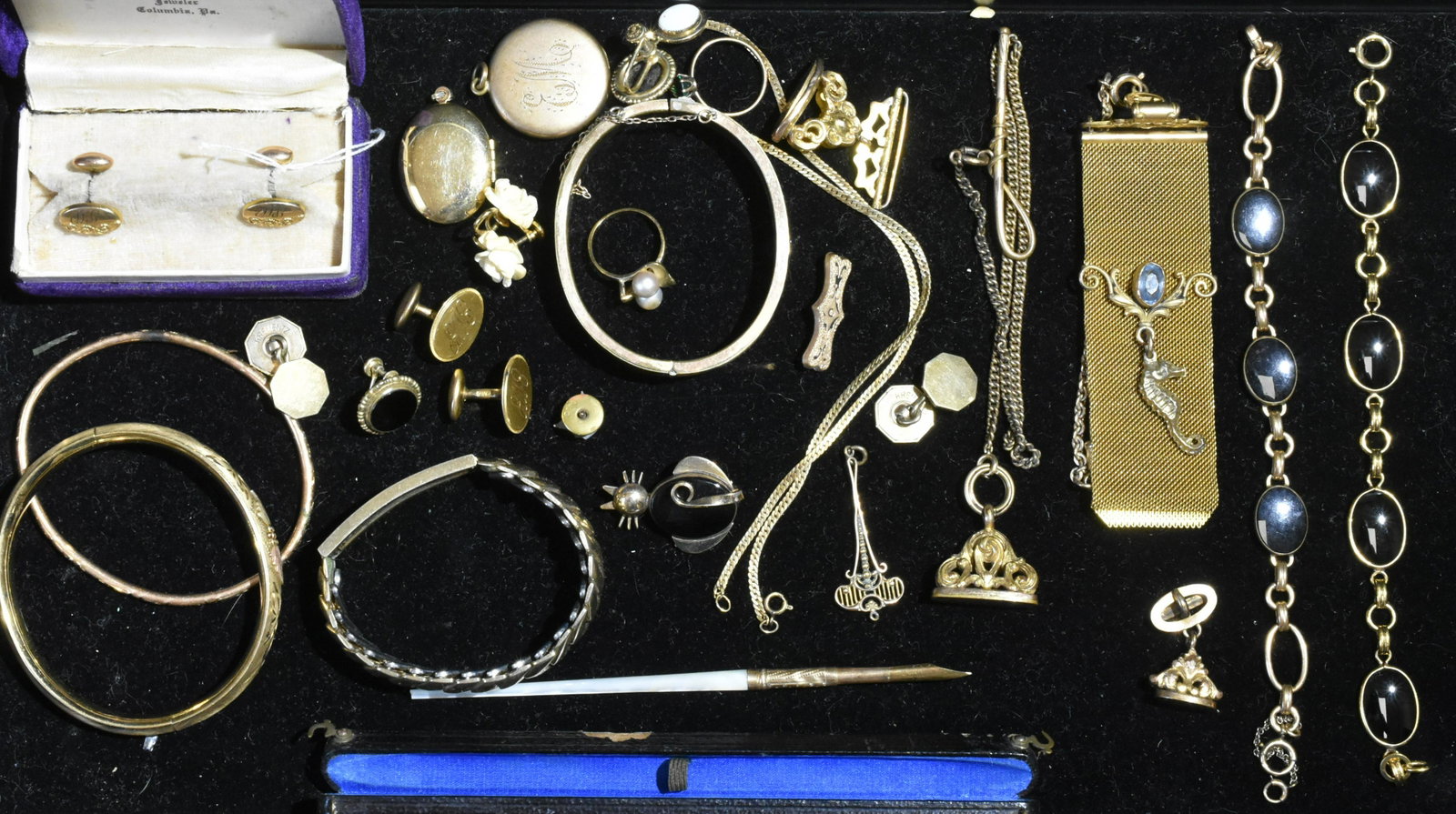 Gold Filled Jewelry Grouping: Lot includes a vintage fob with seahorse, bracelets with onyx stones, dangle bracelets, fobs with monograms, lockets, and more.