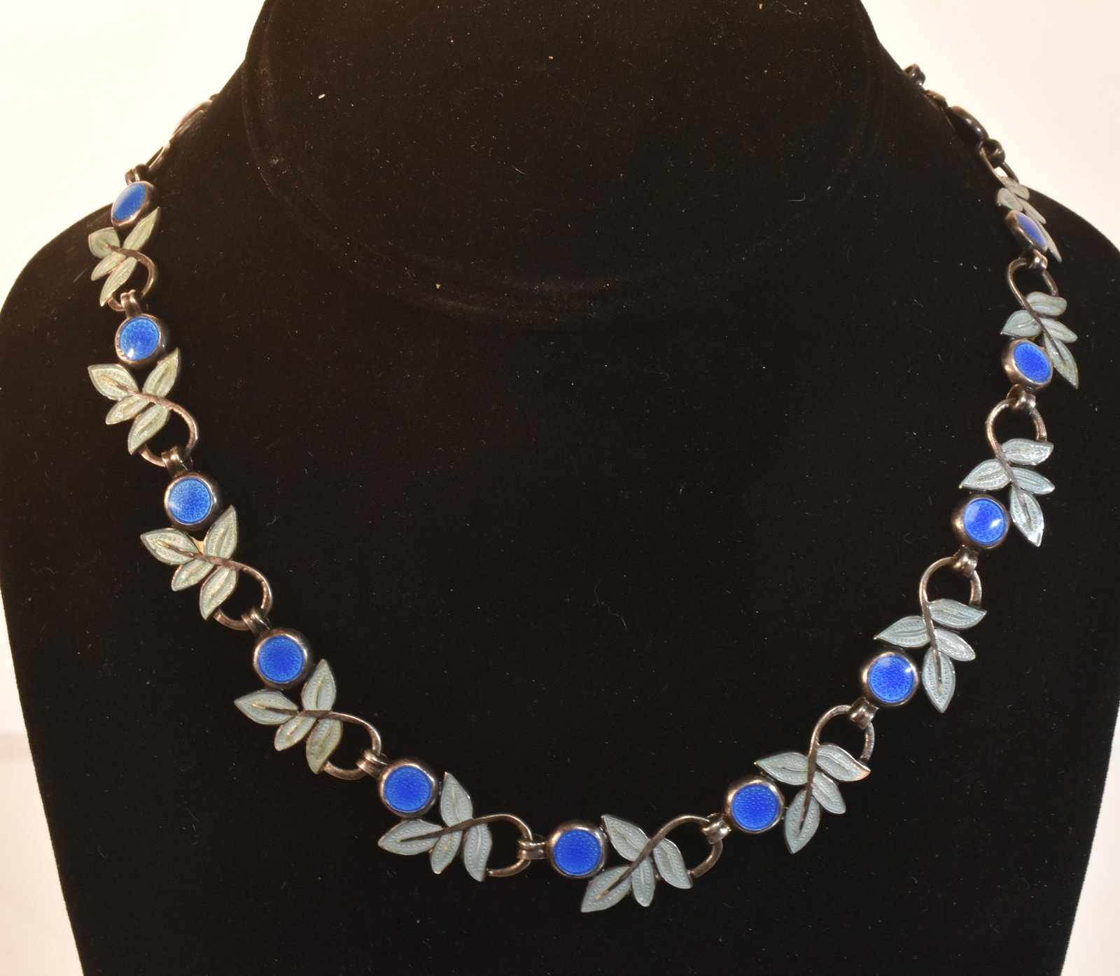 Margot de Taxco Champleve Necklace: Item measures approximately 17"L. It has blue and aqua Champleve inlay with a leaf and berry design. It has excellent color and it is signed on back.