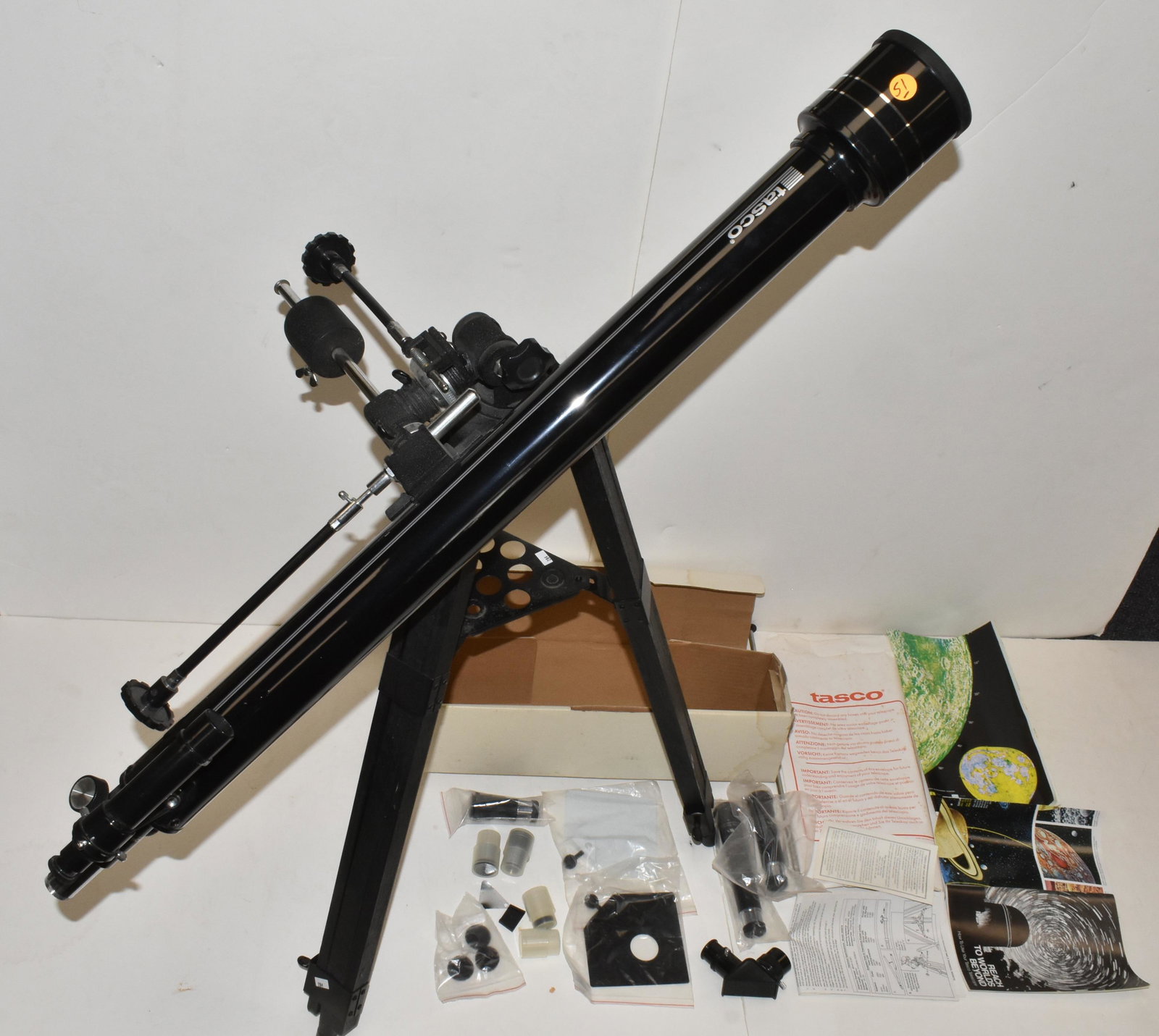 Tasco Stargazer Telescope: Telescope measures approximately 36"L. Item is complete and it includes a tripod, accessories, and instruction manual.
