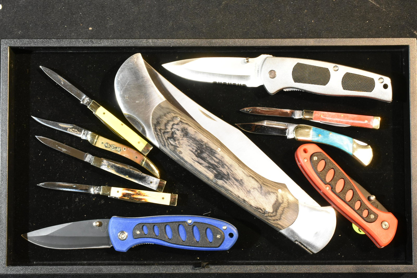 Collection of Folding Knives: Lot includes a Timber Rattler with an 8" blade, Frost Cutlery knife with a stainless body and various other Frost Cutlery knives. (10) total pieces.