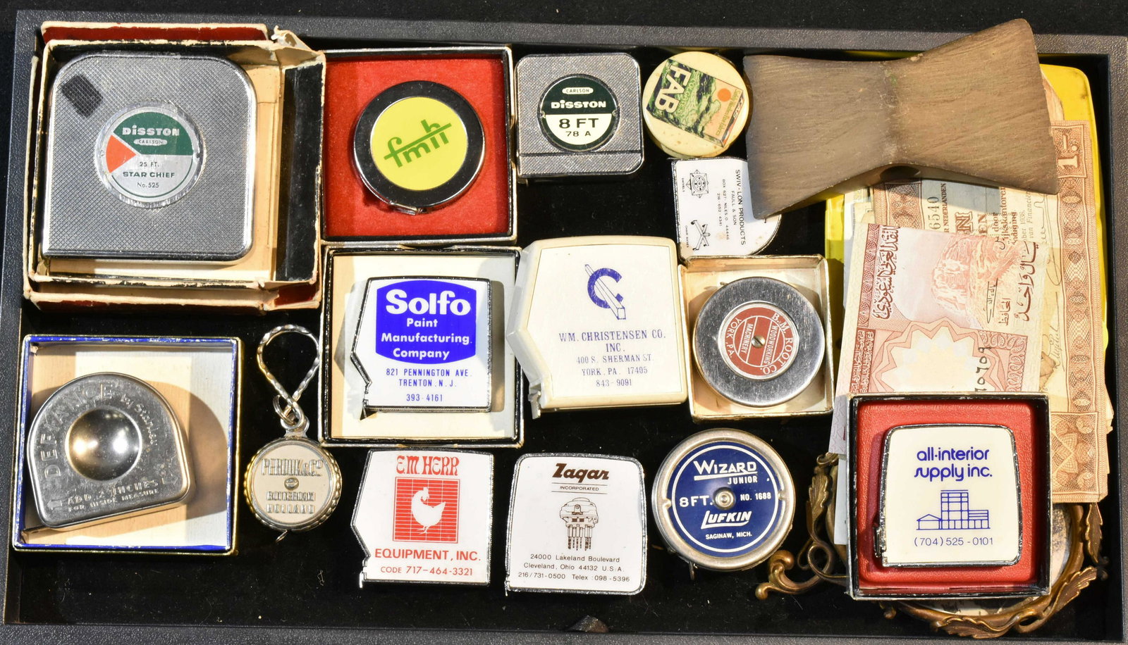 Advertising and Vintage European Currency: Lot includes a pinup ashtray, a vintage brass frame with photo, French, Japanese and other vintage currency and a selection of advertising measuring tapes.