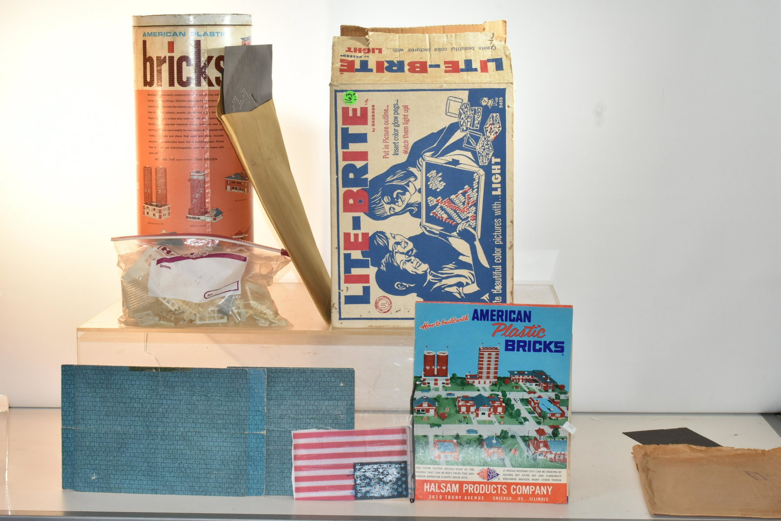Lite-Brite and American Bricks: Lot includes Lite-Brite #5455, a pack of Hasbro Lite-Brite cards, (2) boxes of Lite-Brite pegs and viewer, and a large container of American Plastic Bricks.