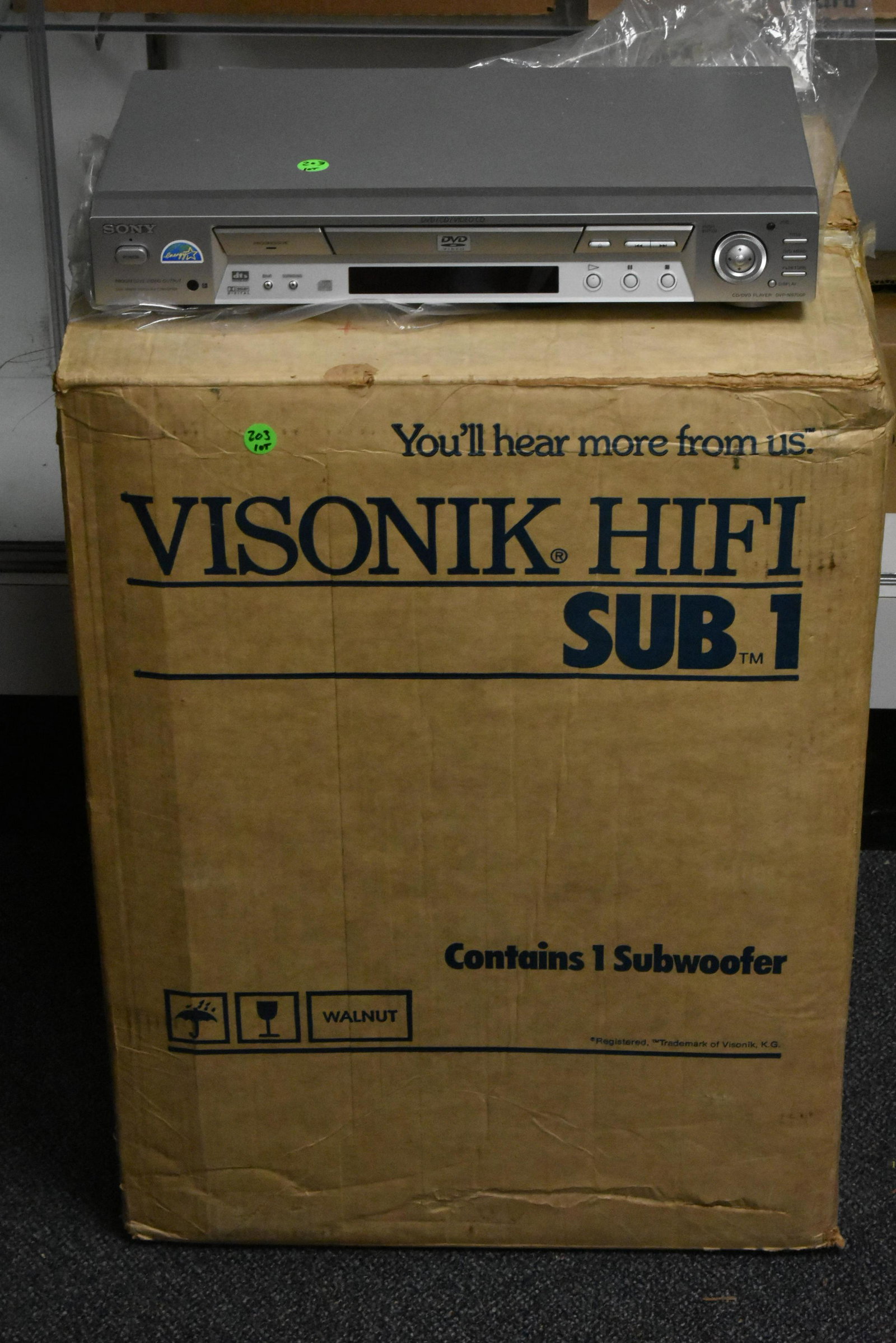 Stereo Electronics: Lot includes a Sony NS-700P DVD-CD player, and a Visonik HIFI sub woofer in box.