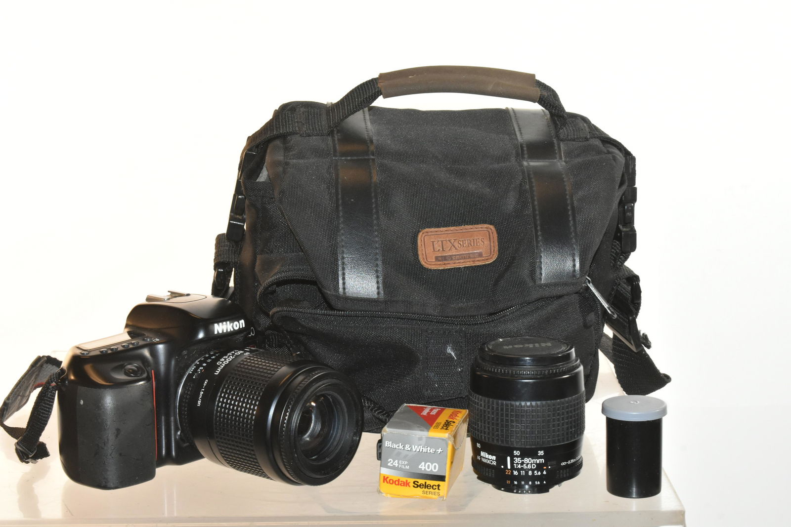 Nikon N-50 35mm Camera: Item comes with an 80-200mm lens, a 35-80mm lens, and original case.