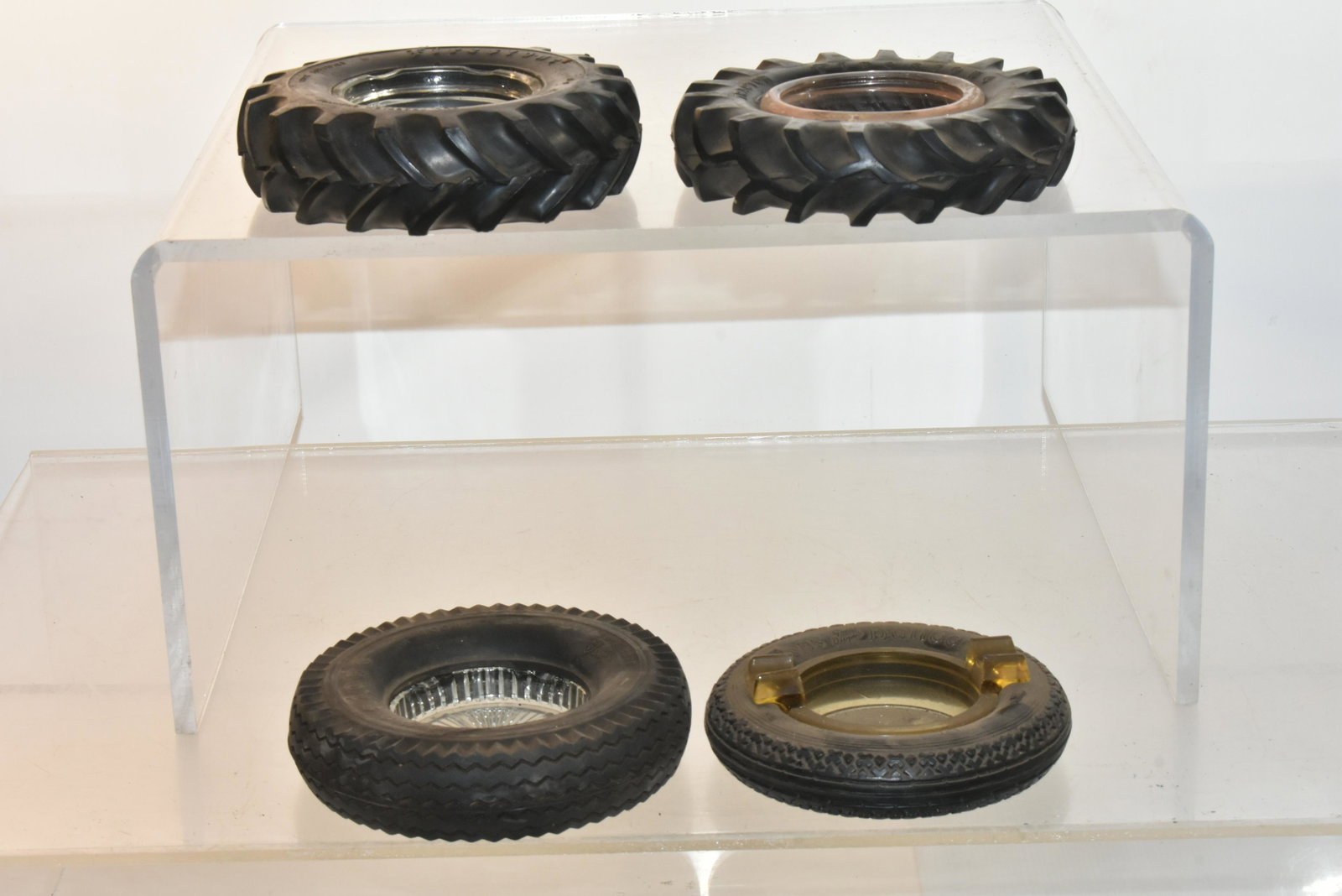 Vintage Firestone Tire Ashtrays: Lot includes (2) tractor tire ashtrays, a Firestone balloon, and a Firestone safety lock.