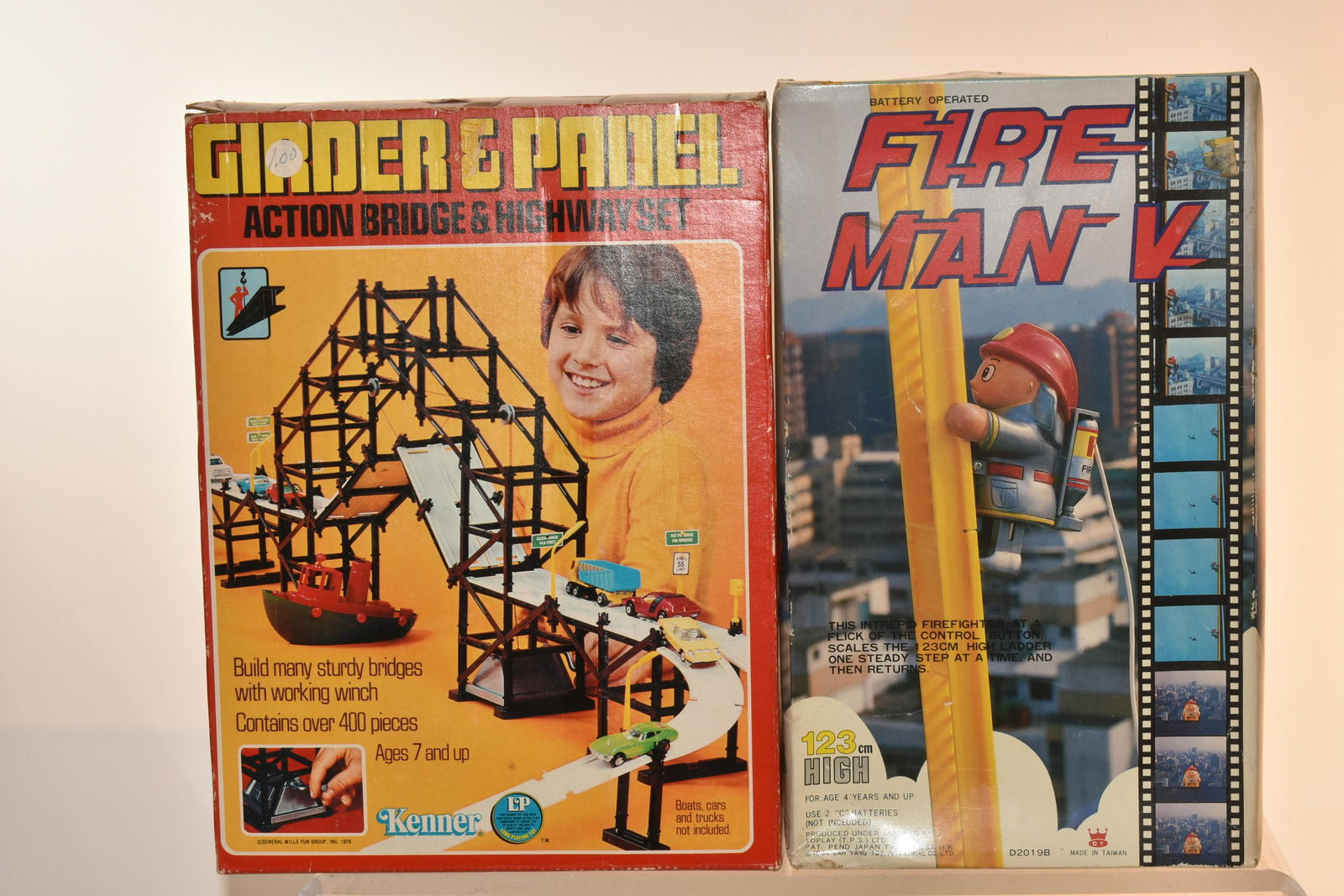 Battery Operated Fireman and Kenner Bridge: Lot includes battery operated fireman that climbs ladder, a Girder and a Panel Action Bridge and Highway Set by Kenner. Both items in box.
