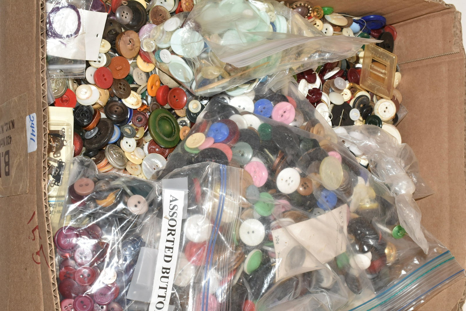 Massive Collection of Vintage Buttons: Lot includes over (1000) buttons, including metal buttons, plastic buttons, decorative buttons, and bakelite buttons.