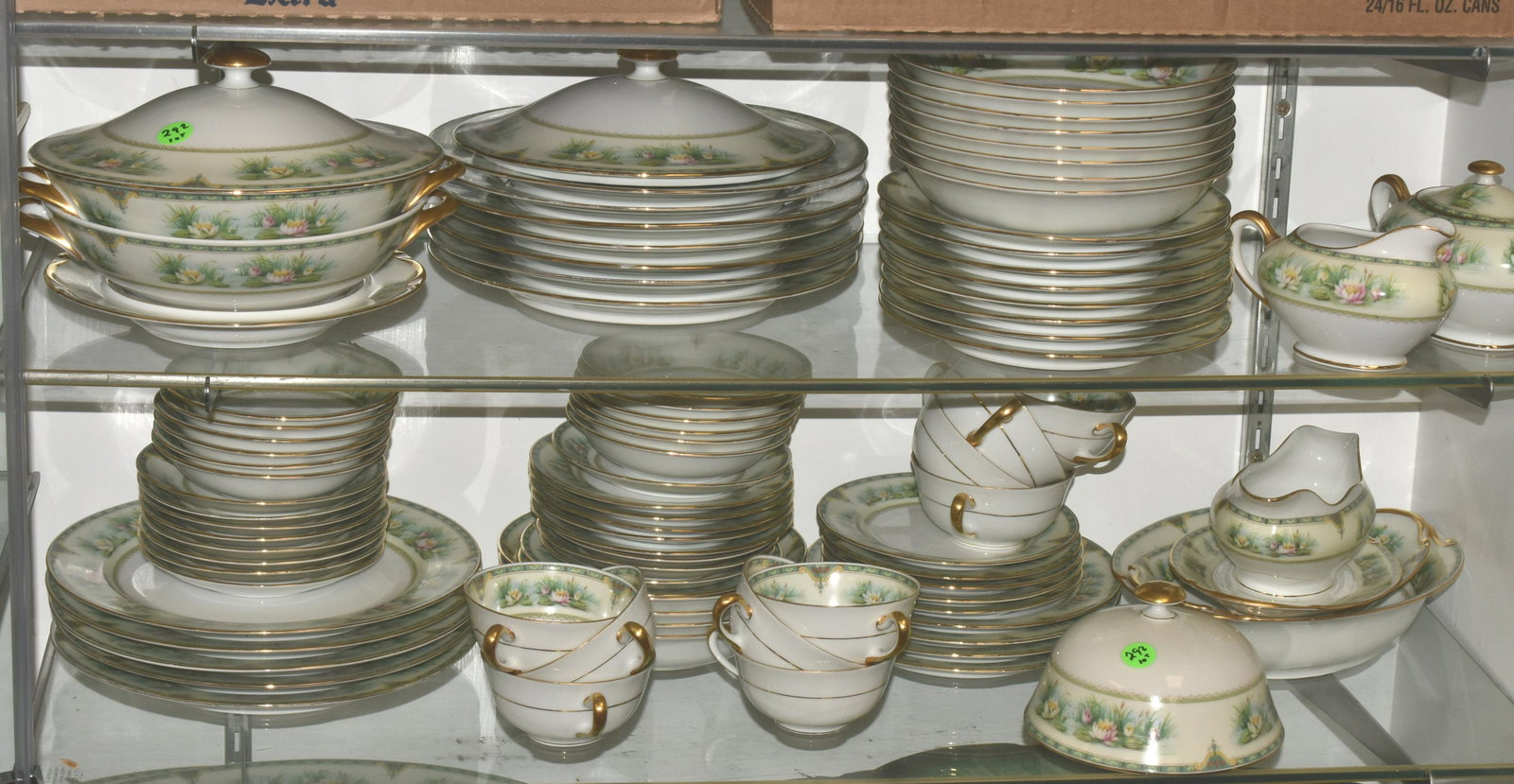 Diana China Service Cassandra Pattern: Large service with (2) oval platters (largest measuring 16"L), (2) covered vegetable platters, dinner plates (some with chips), gravy boat, salad plates, creamer and sugar, berry bowls, cups and sauce