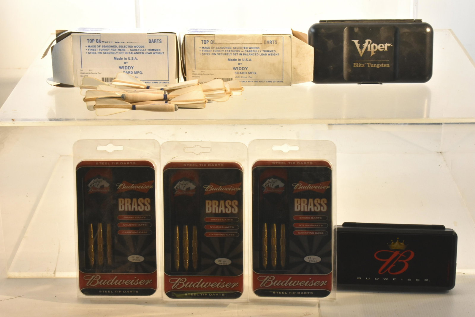 Grouping of Darts NIB: Lot includes (3) sets of Budweiser brass darts, (2) sets of Viper Blitz darts, and (2) sets of turkey feather darts.