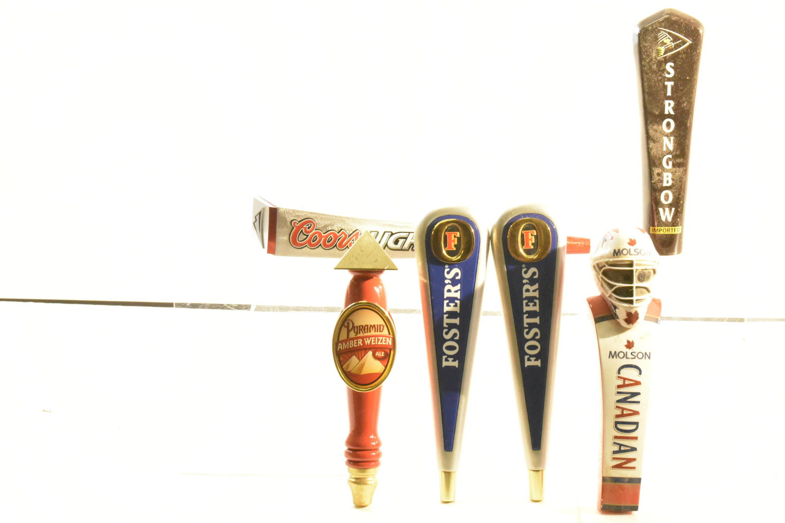 Collection of Beer Taps: Lot includes (2) Foster's, a Molson, a Coors Light, a Strong Bow, and a Pyramid.