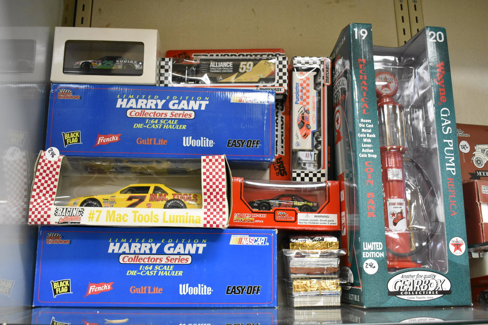 Nascar and Texaco Grouping: Lot includes (7) Nascar vehicles, Nascar playing cards and a large Texaco gas pump.
