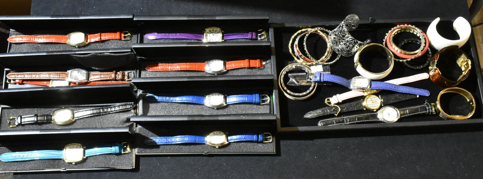 (2) Trays of Ladies Watches and Bangles: Lot includes (8) ladies Gossip watches in original box, a lucite cuff, a selection of bangle bracelets, ladies cuff watch with abalone inlay, and other ladies watches.