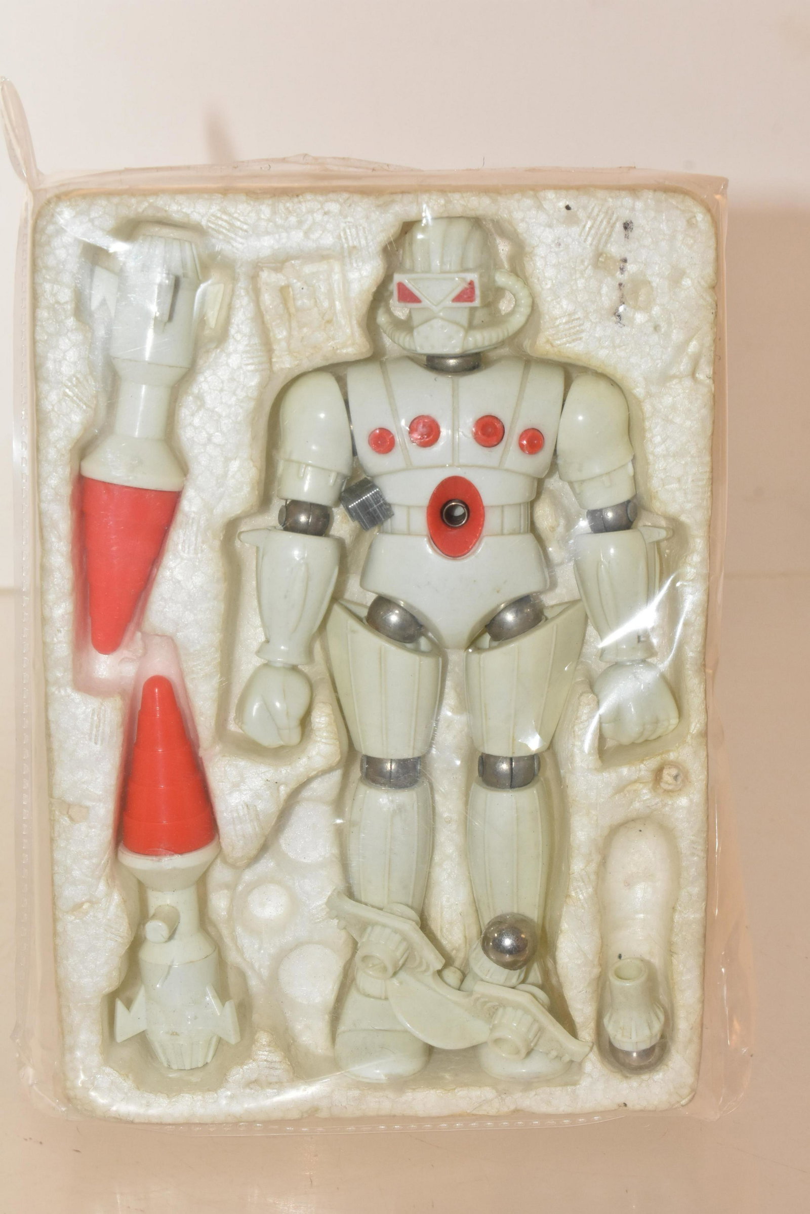 Magnetic Robot Toy: Toy measures approximately 5.5"H. It has magnetic connectors. It is in original Styrofoam package, the box is lost. Toy appears to be complete.