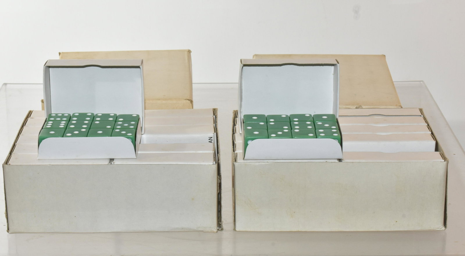 (2) Boxes of Old Stock Dice: Each box contains (12) pack of dice, all green. The boxes have factory packaging label.