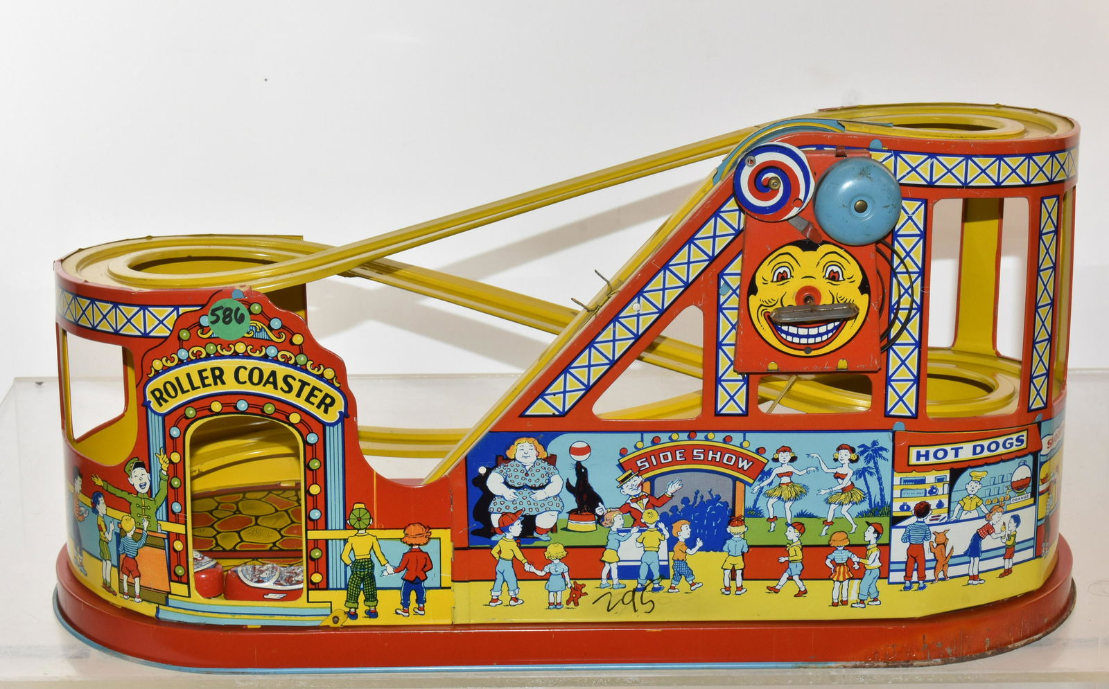 J. Chen Tin Litho Roller Coaster: Item measures approximately 10"H x 19"L. It has very good graphics, and it retains both cars. The key wind mechanism works, and the belt is loose but can be tightened.