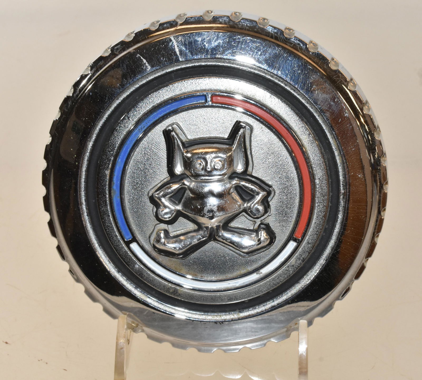 AMC Gremlin Gas Cap: Gas cap measures approximately 2.75" diameter. It has a three dimensional Gremlin with original red, white, and blue paint, and it appears to be complete.