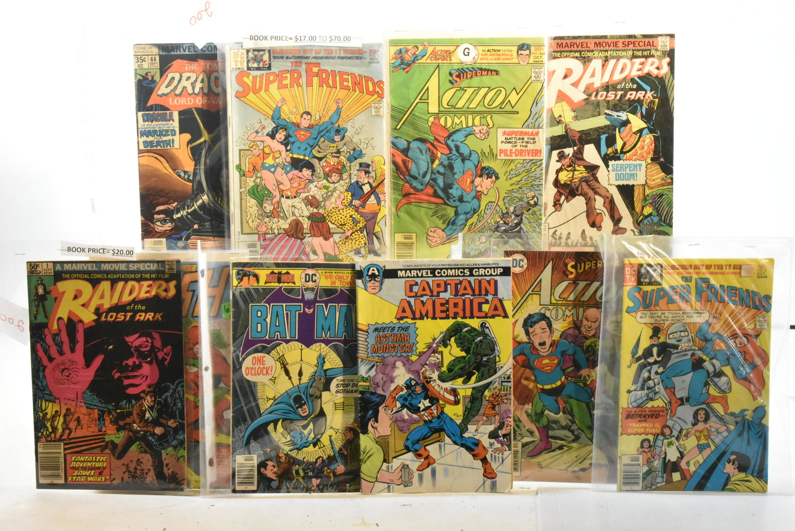 Vintage Superhero Comics: Lot includes Batman 280 (30c), Superman 466 (30c), Dracula 66 (35c), Raiders of the Lost Ark 1 & 2 (50c), and others.
