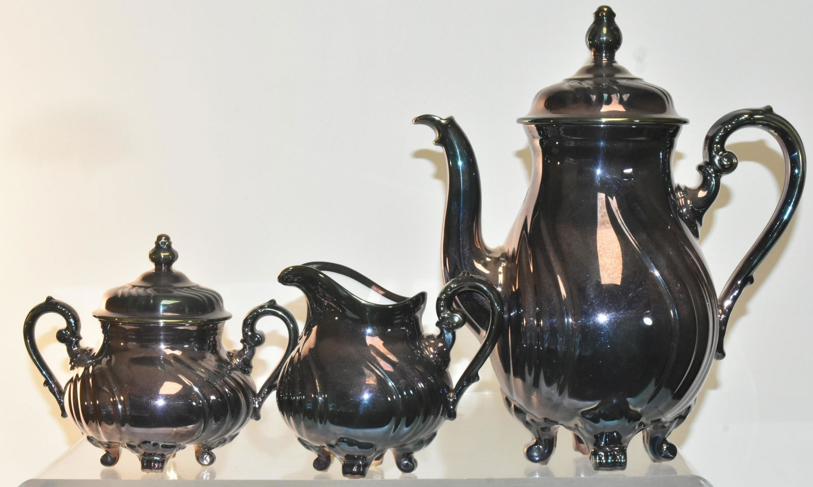 Rosenthal Feinsilber Auflage Tea Set: Lot includes teapot measuring approximately 11"H, and matching creamer and sugar. All are marked.
