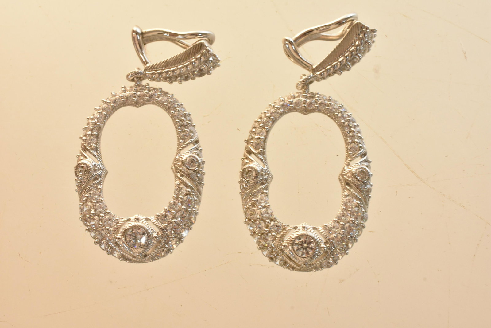 Designer Judith Ripka Sterling Earrings: Lot includes signed door knocker sterling silver earrings, with CZ and filigree design.