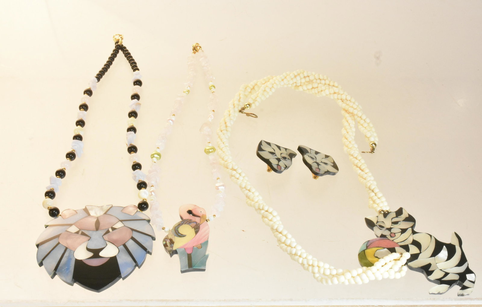 Vintage Shell Lion and Animal Jewelry: Lot includes large, shell, multicolor lion necklace signed Lee Sands, pink flamingo necklace, and tiger little cats shell necklace.