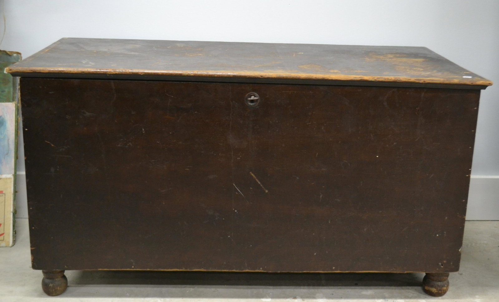19th C Blanket Chest: Item measures approximately 21.5"H x 41"W x 21"D. It is pine construction with rabbet joints. It stands on a ball foot, it has original lock and key. Lid is currently not functioning.