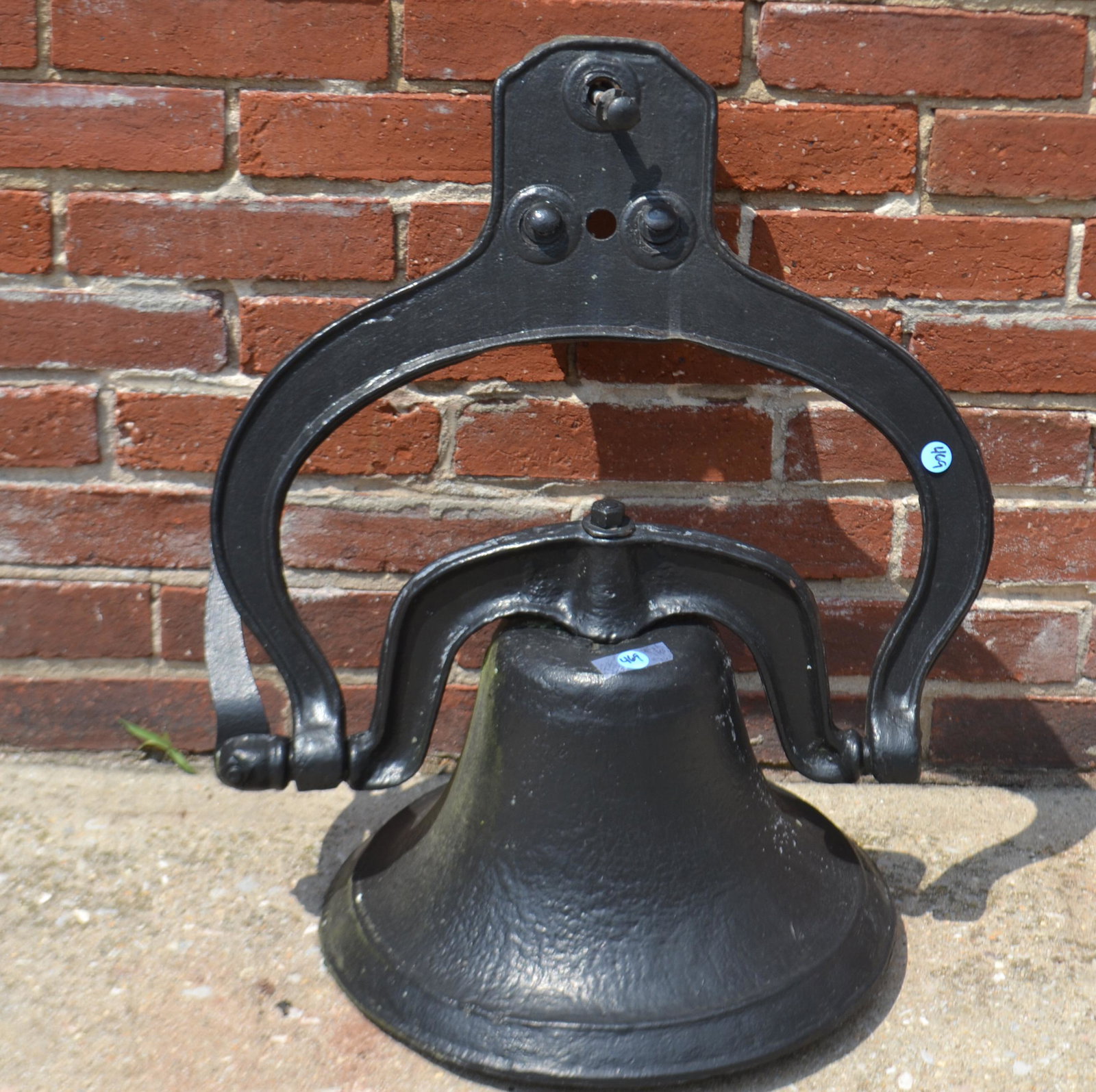 Cast Iron School Bell: Item measures approximately 12"H, not including hanger, and 14" diameter. Bell comes with original hanger and bolts.