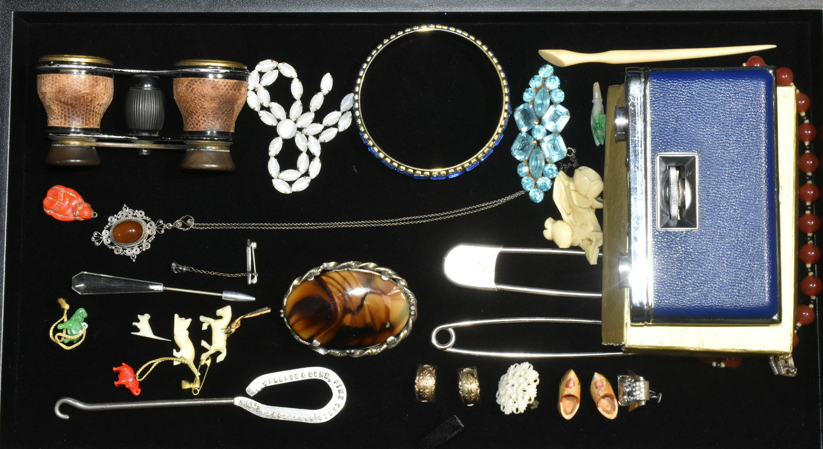 Costume Jewelry and Opera Glasses Grouping: Lot includes (2) pairs of opera glasses, one marked BNN, vintage pin with blue rhinestones, bangle with blue and clear rhinestones, large brooch with model brown polished stone (stone has scratch in o