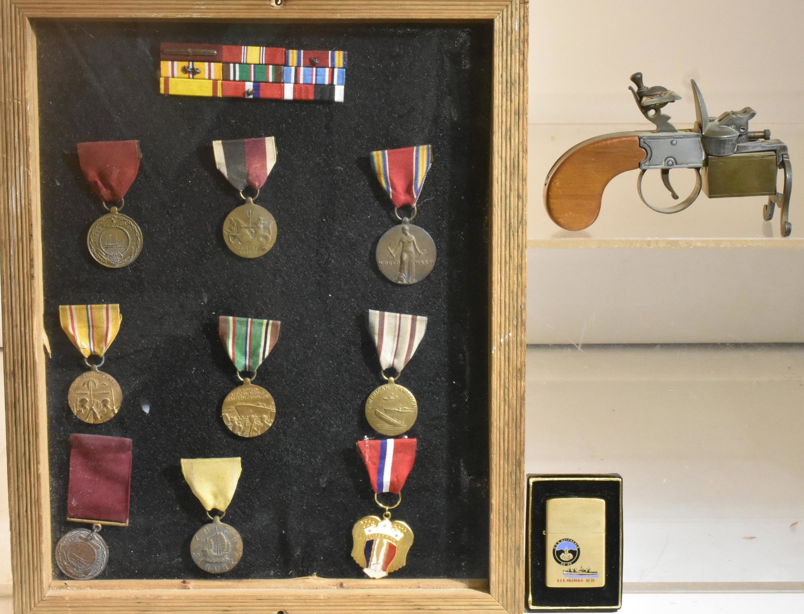 Framed Military Medals and Related Items: Lot includes (9) framed military medals with (3) bar pins, a Zippo USS Haleakala Lighter in box, and a Dunhill tinder pistol lighter.
