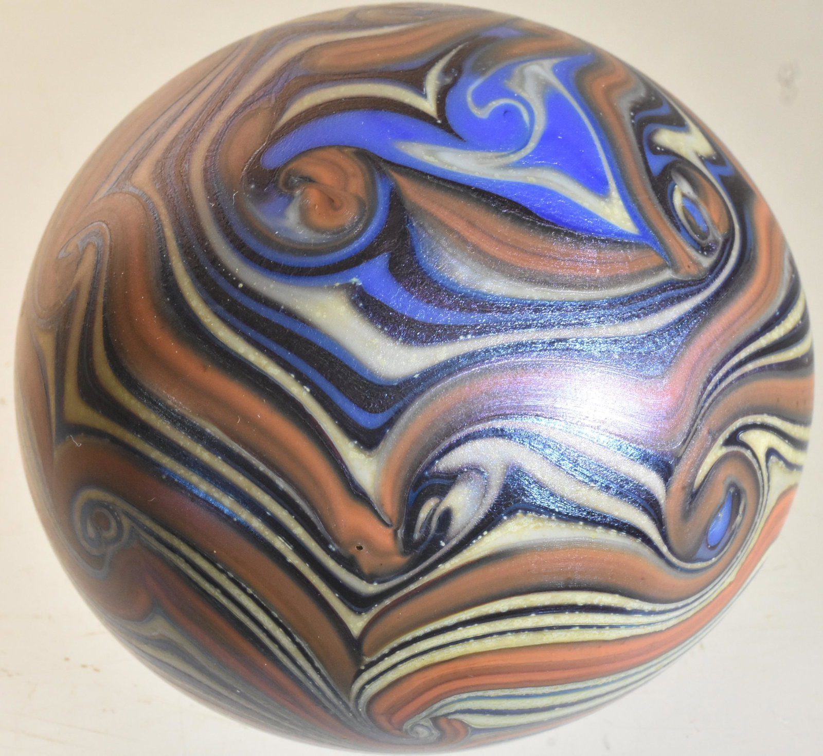 Orient and Flume Art Glass Paperweight: Item measures approximately 2.25"H. It has a multi color swirled art glass body, and it is etched Orient and Flume 154874.
