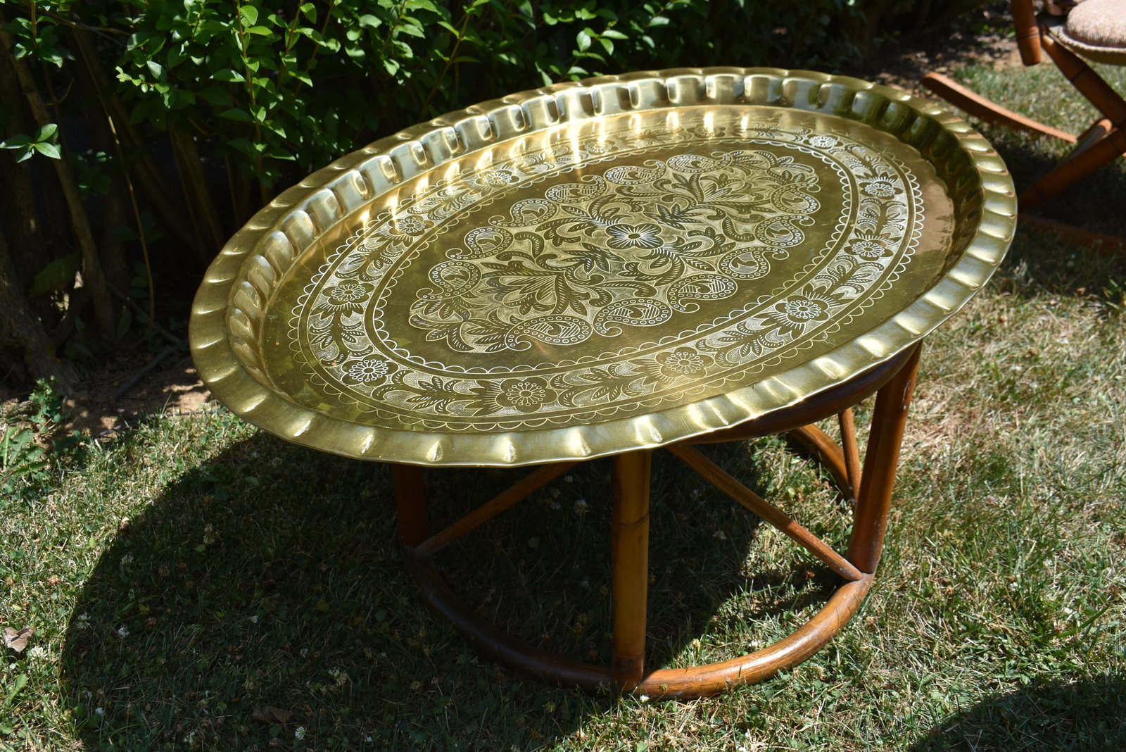 Contemporary Brass Top Tray Table with Rattan Base: In good condition. Brass tray is embossed.