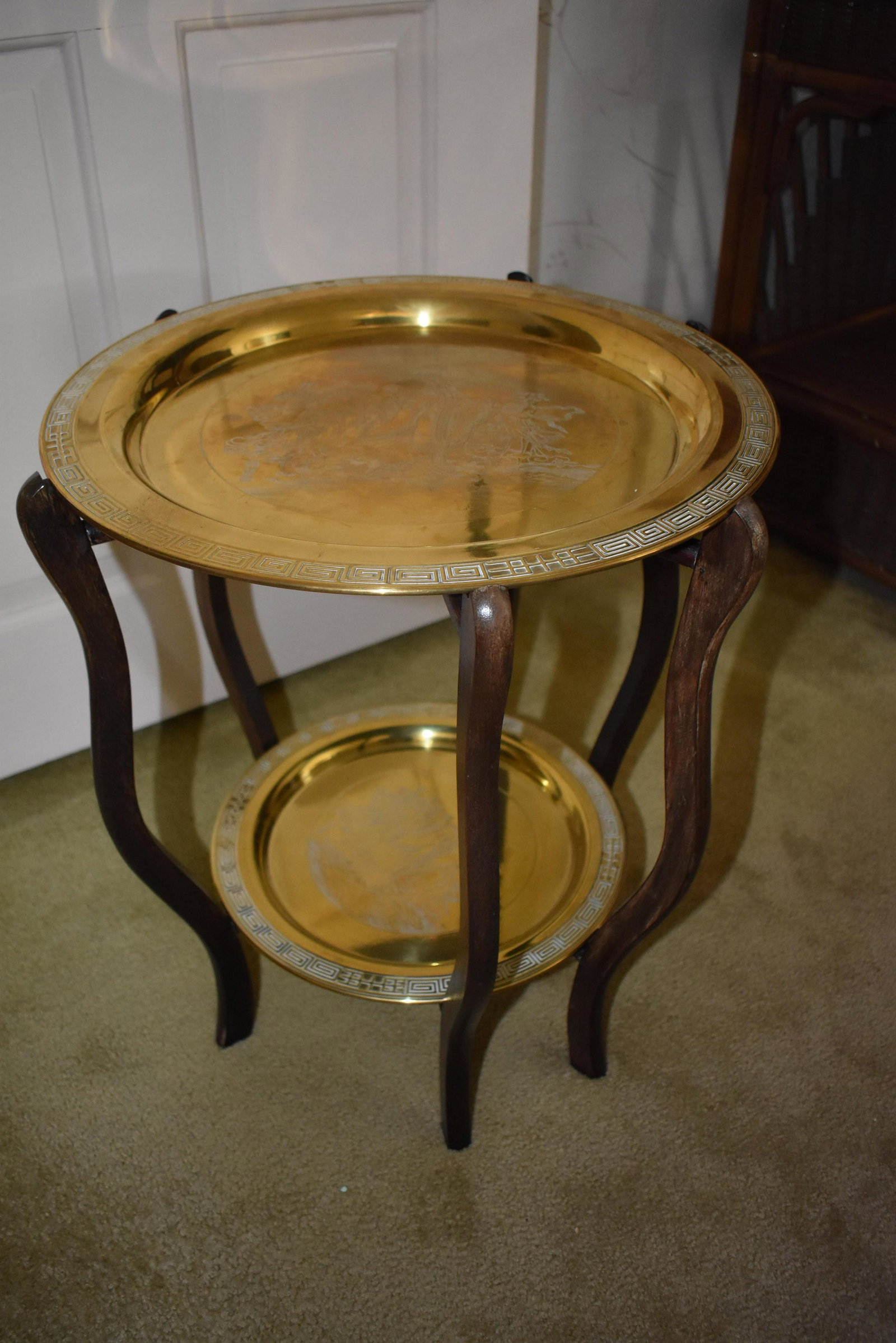 Two Tiered Brass Tray Table: Trays are decoratively engraved and removable from collapsible base.