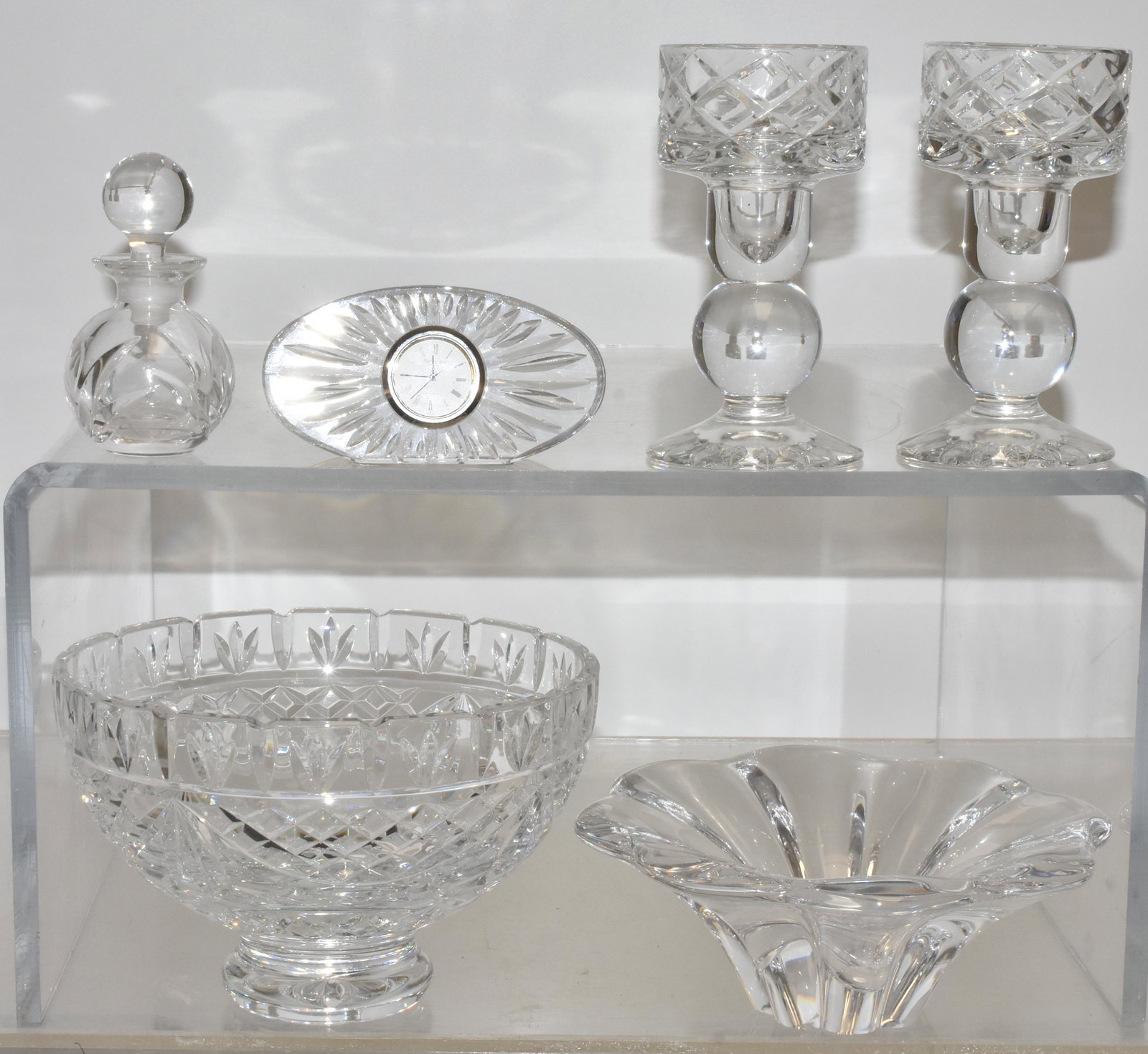 Waterford and Other Crystal: Lot includes a Waterford fruit bowl (8" diameter), Waterford clock, and Waterford perfume bottle, a pair of Block crystal candle holders, and an Orrefors bowl.
