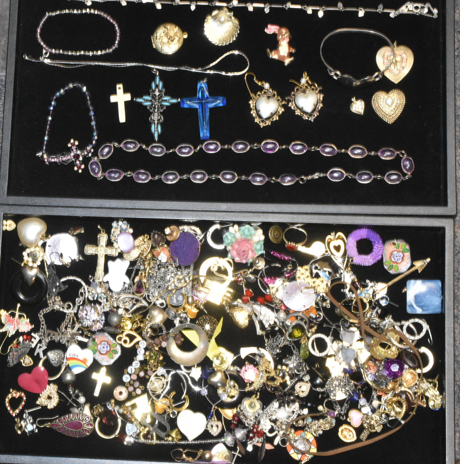 (2) Trays of Costume Jewelry: Lot includes floral locket, various earrings, bracelet with heart, and other costume jewelry.