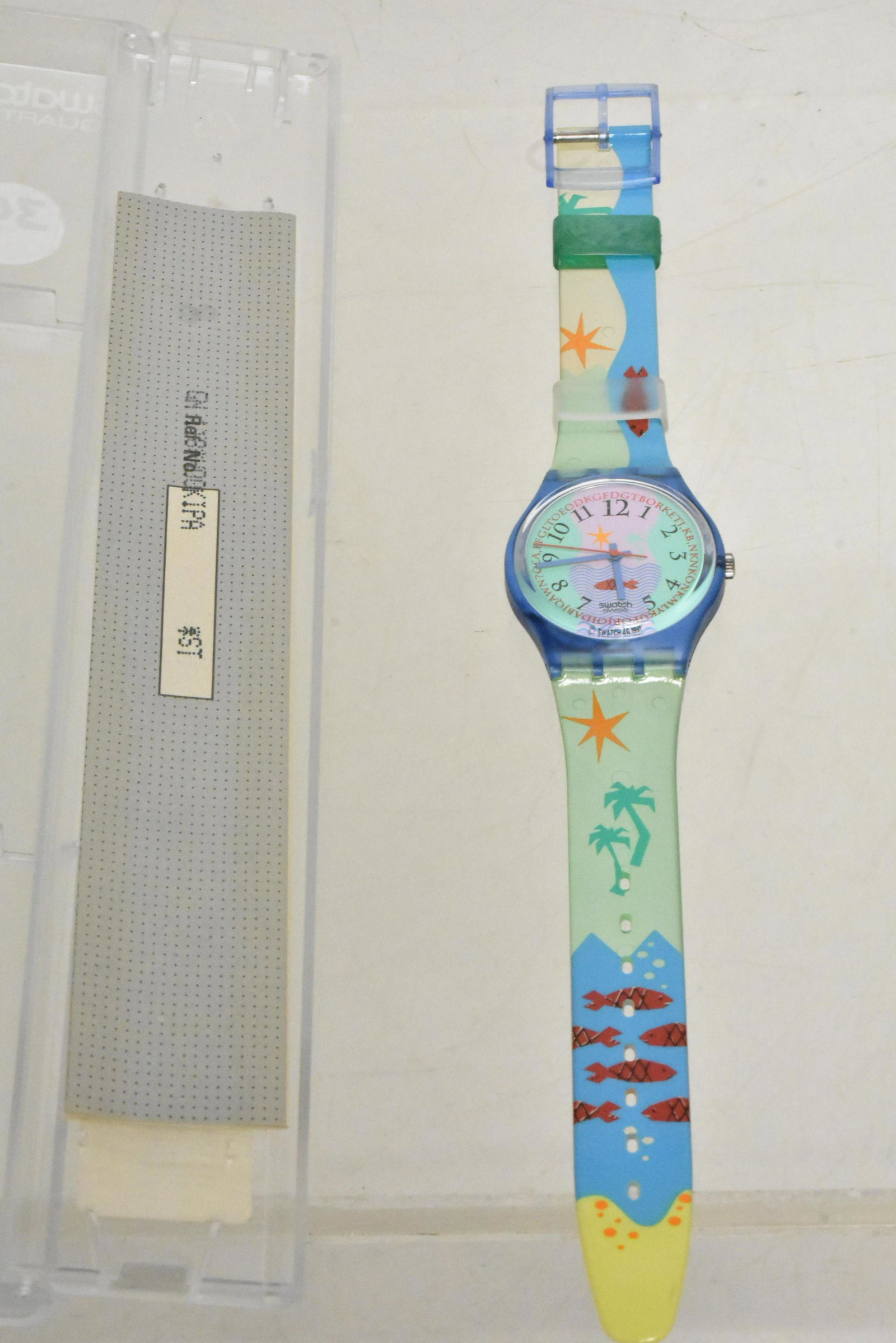 Swiss Made Swatch NIP: Ocean motif band and face. NIP. Dated 1991.