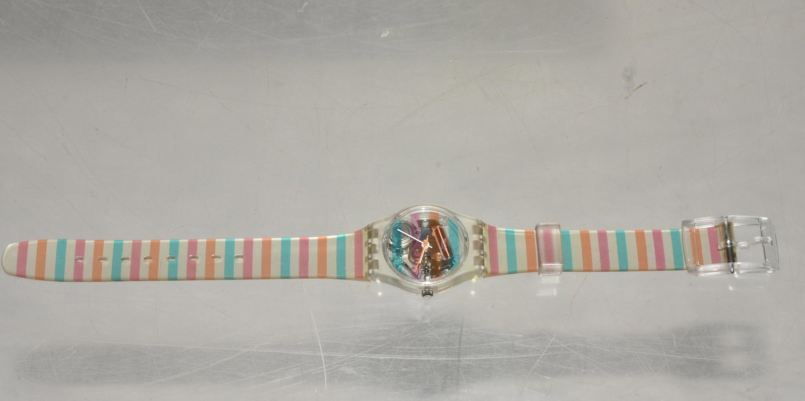 Skeletal Swiss Made Swatch NIP: Striped band. Skeletal view face. Dated 1987. NIP.