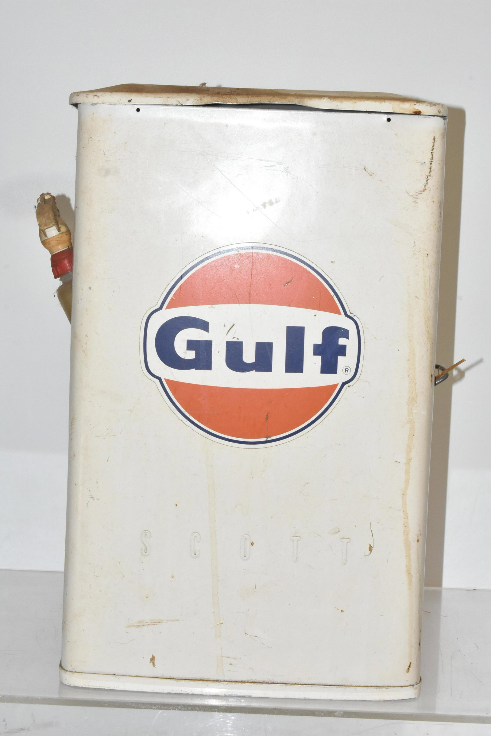 Vintage Gulf Oil Utility Trash Can: Approximately 20"H. Metal trash can with Gulf Oil logo, "Scott " written in body. Retains original squirt bottle in left side bracket.