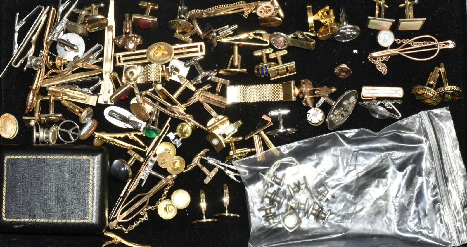 Cufflinks and Tiebacks: Lot includes various cufflinks and tiebacks.