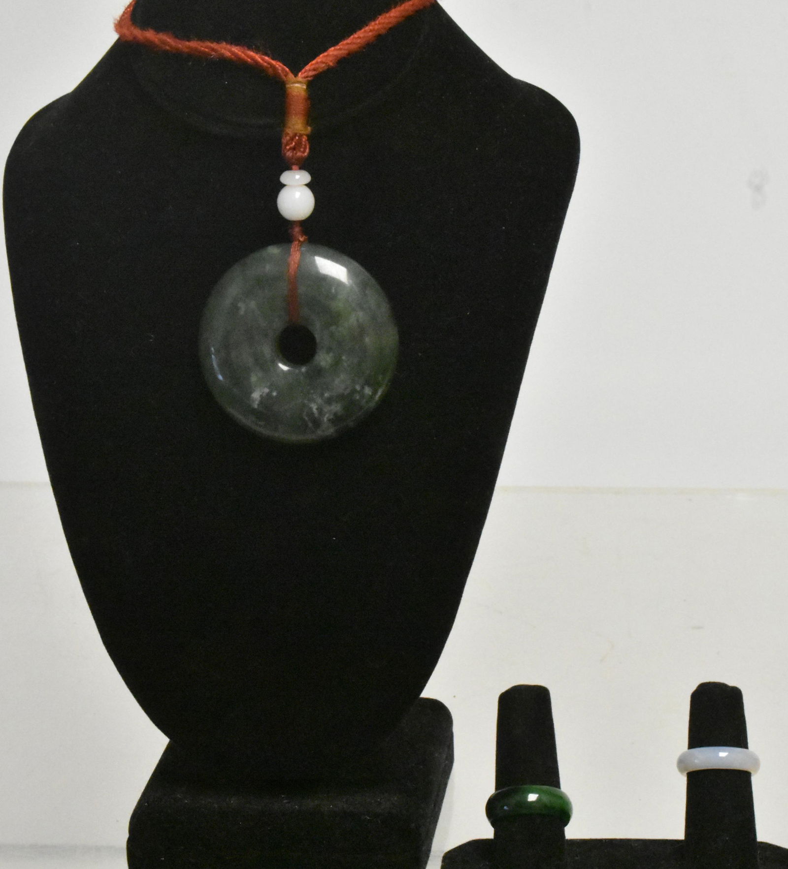 Jade Ring and Jade Type Jewelry: Lot includes a green ring that tested jade, a jade style blind pull, and a white jade style ring.