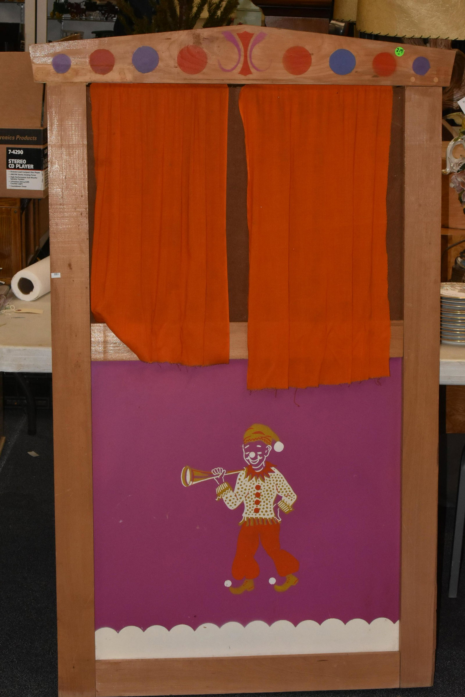 Puppet Show Frame: Approximately 57"H x 35"W. Wood and mason board construction with stenciled decorations, cloth curtains, and fold out sides. Appears to date to the 1960s or 1970s.