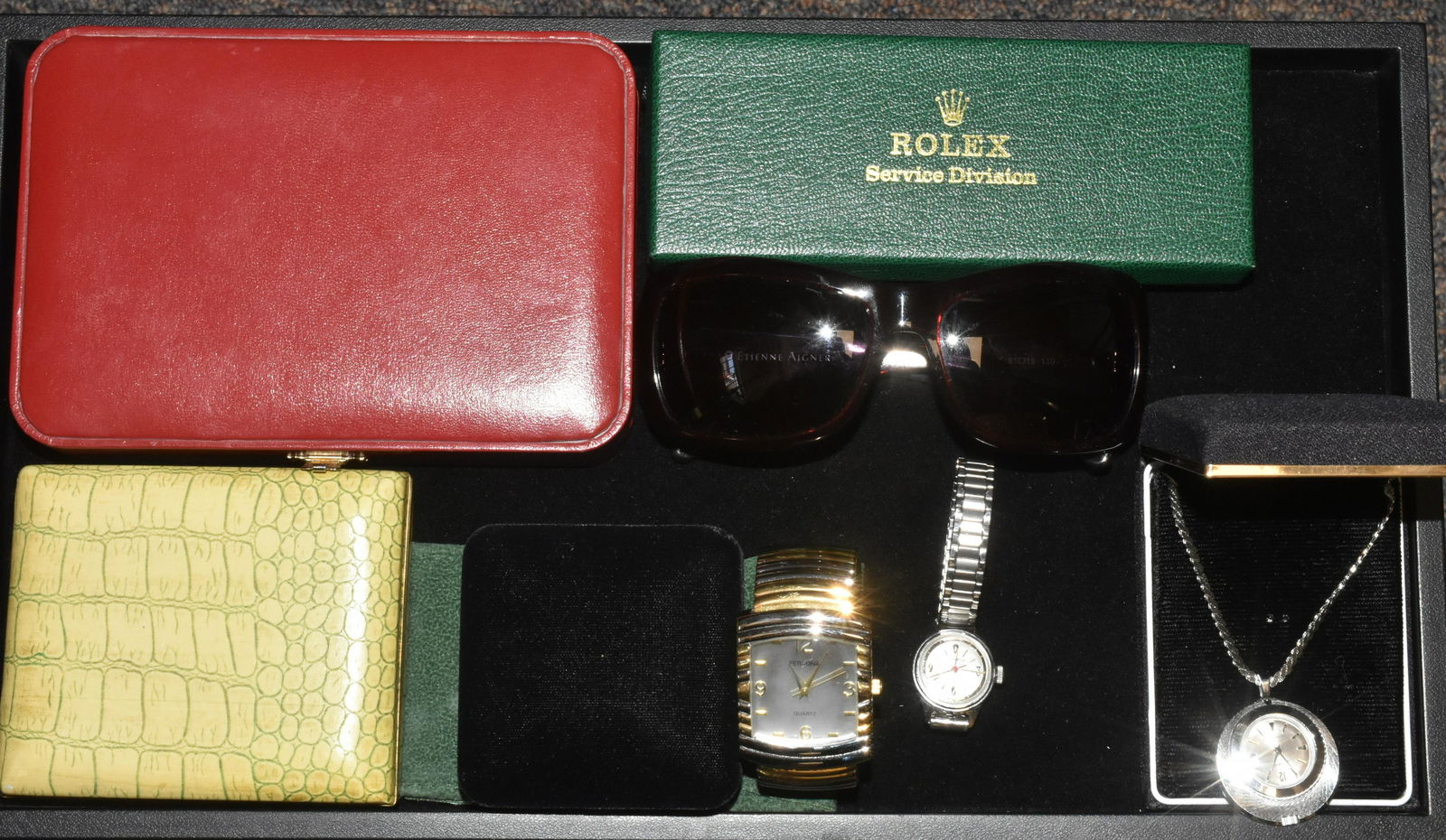 Three Watches and Jewelry Cases: Including men's persona wrist watch, Ladies caravella, Sheffield pendant watch, Jewelry cases one is Rolex and a pair of Aigner sunglasses.