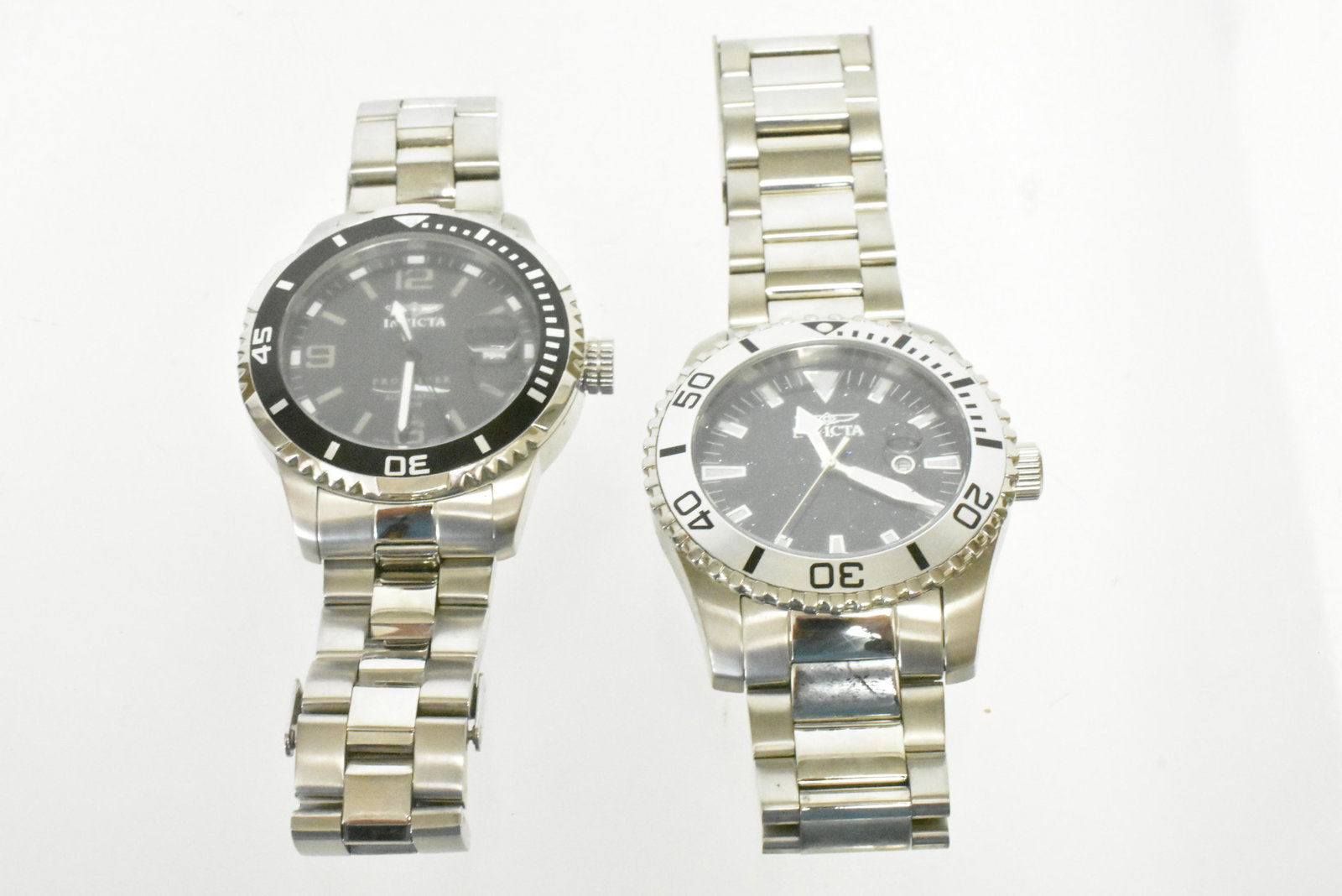 Invicta Watches: First watch is an automatic water resistant watch (200M). Watch reads â€œPro Diver 200m” and has flame fusion crystal (I.D#6036). Watch has all three hands and Japanese movement. Second watc