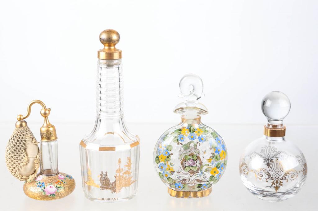 Baccarat Houbigant Cologne Bottle and Others: Cologne bottle (8"H) having a gold flash scene with fountain on side, with Houbigant below. Numbered painted glass stopper. Gold flashing shows wear to knob. Acid etched Baccarat, France on bottom. Lo