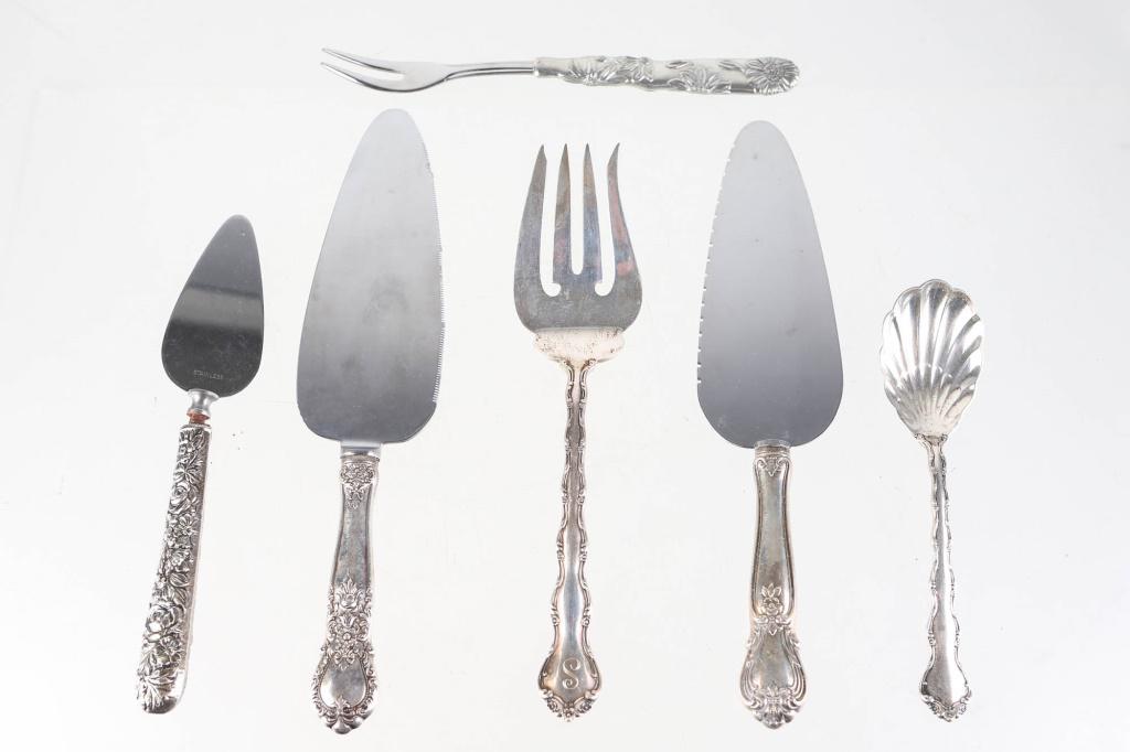 Sterling and Sterling Weighted Serving Pieces: includes (6) serving pieces, including cake servers, and a small dessert server (missing band at neck), a two-prong serving fork, a large serving fork, and a shell body serving spoon (130g total). Fro
