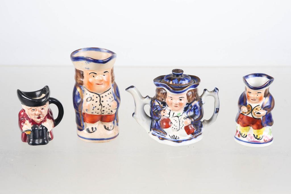 Gaudy Welsh Toby Miniatures: Largest approximately 3.75"H. (3) Gaudy Welsh Toby mugs, and a teapot. Teapot has company marking that is vague and reads Est. 1831, Made in England. Smallest also has marking on bottom that reads Sta