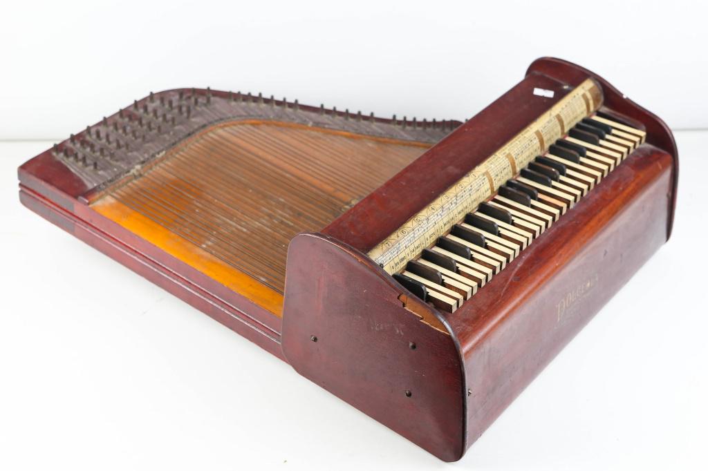 Toledo Symphony Dolceola: Approximately 23.5"H x 18"W. Early 20th C. Original logo. All keys appear to function. 3" x 0.5" veneer loss to one side.