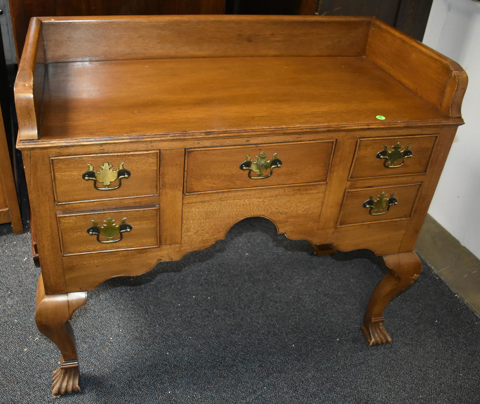 Cabinet Made Mahogany Lowboy 19th/20 C: Approximately 34"H x 37"W x 19"D. Heavy gallery, hand dove tailed drawer with later brasses, an aggressive skirt on fronts and sides with beading, a high knee, and it stands on fan feet.