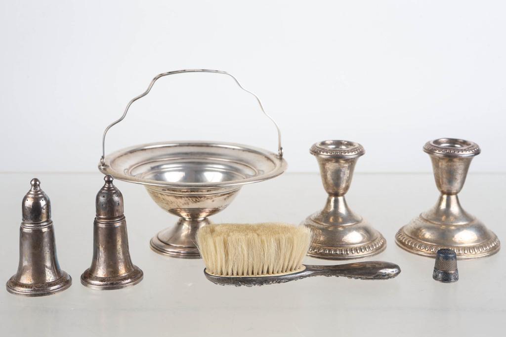 Sterling Silver Weighted Grouping: includes an International sterling silver handled bowl (6" diameter x 6"H to top of handle), a pair of Empire sterling weighted candlesticks, a sterling thimble, a pair of Empire sterling weighted sal