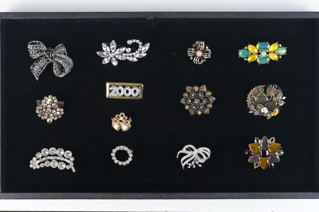 Rhinestone and Other Costume Jewelry: includes various rhinestone pins and brooches, a Monet brooch with green and yellow stones and related items.