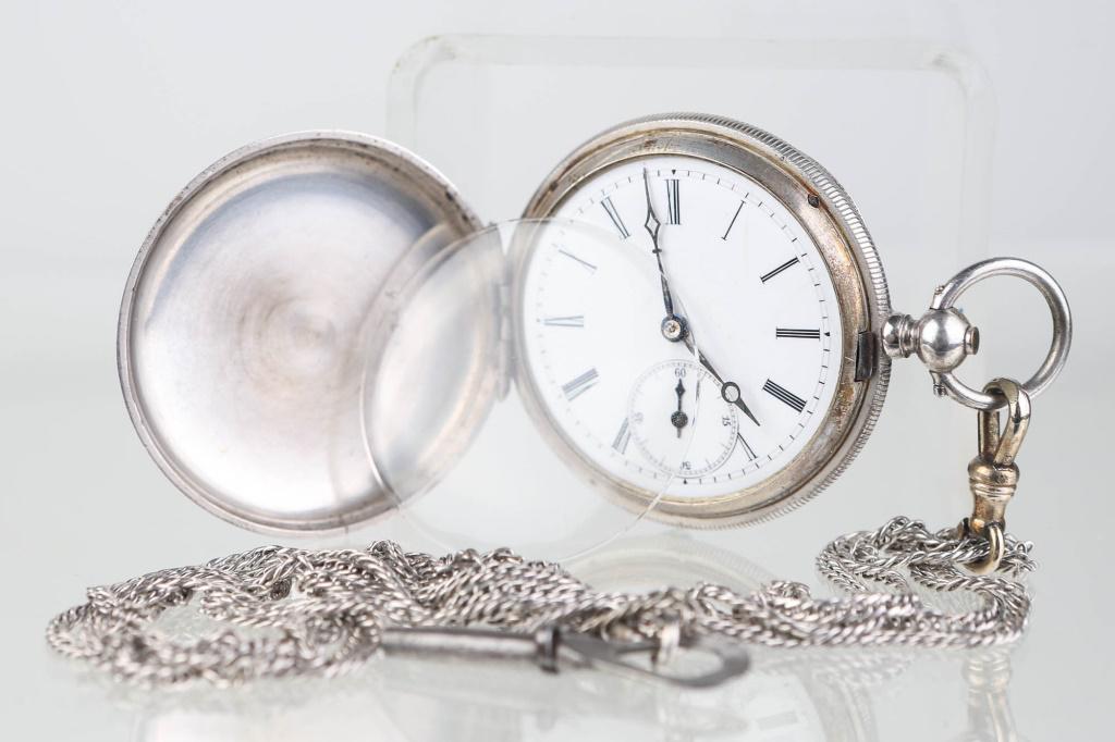 R. Brandt Geneva Pocket Watch & 14K Fob/Chain: Case measures approximately 1.5" in diameter. Watch has enamel unmarked face. Second hand has loss at back. Case # 56766. Interior of back reads "Patent Lever Full Jeweled Robert Brandt Geneva". Watch
