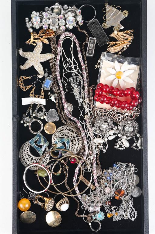Jewelry Assortment: includes rings, necklaces, earrings, a large rhinestone bracelet (missing stone), and more.